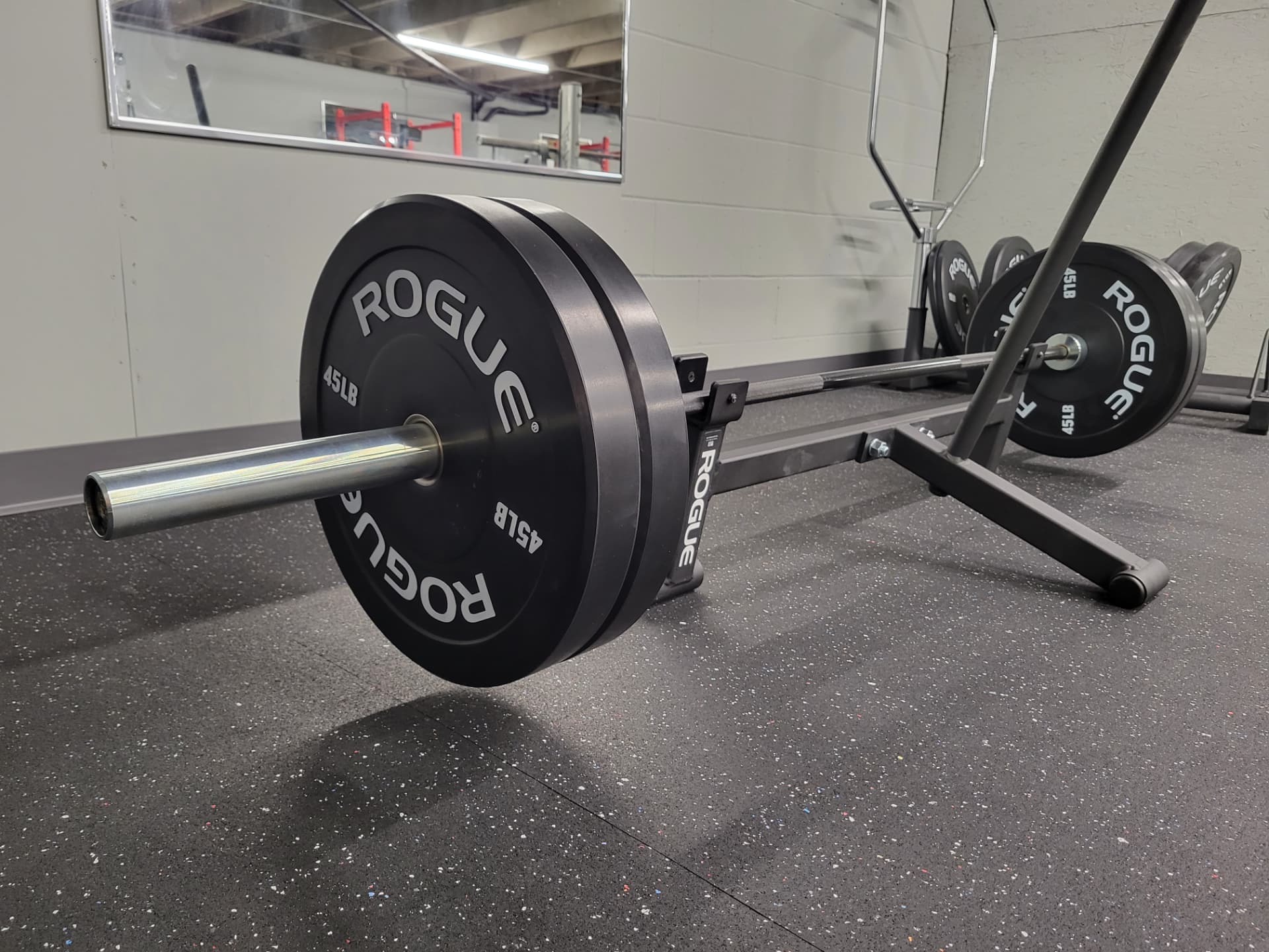 Rogue power racks with barbells and platforms